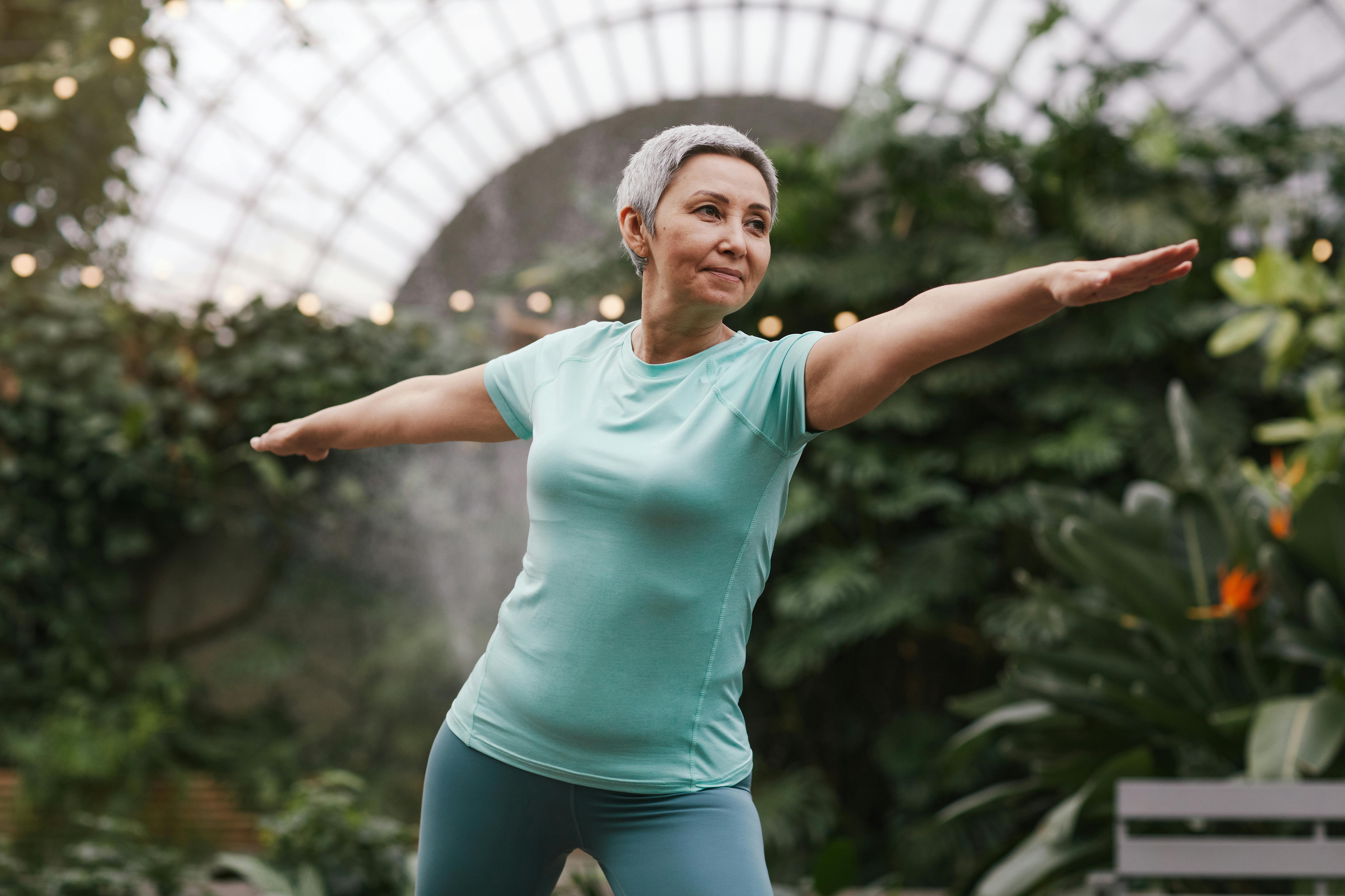 Older woman stretching in a standing lunge position